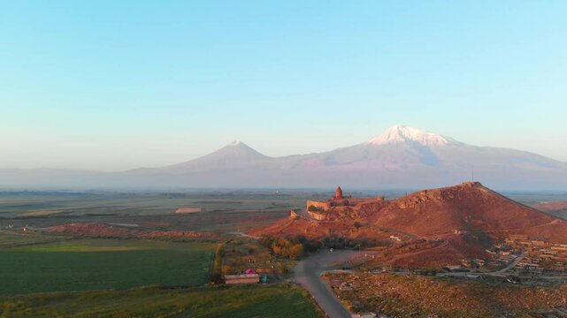 The drone flies to the side Ancient Armenian church Khor Virap with Ararat, Armenia