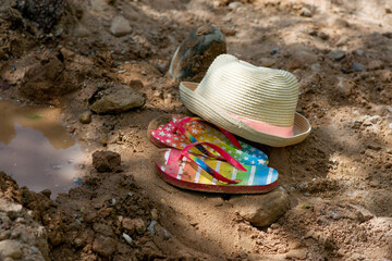 Summer vacation concept: flip-flops and strawn hat. summer in the village. High quality photo