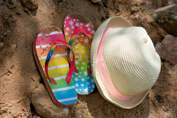 Summer vacation concept: flip-flops and strawn hat. summer in the village. High quality photo
