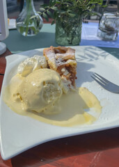 Hot American apple pie with ice and whipped cream