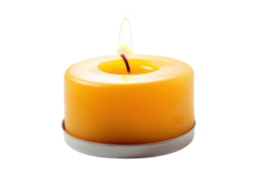 Bright orange candle illuminating a serene space with soft light and warm ambiance during evening hours