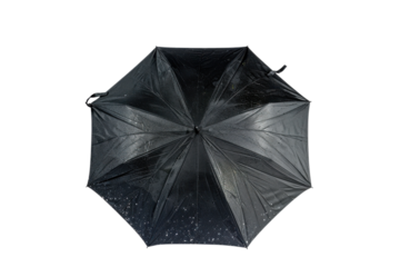 Umbrella with raindrops resting on it during a rainy day in the city