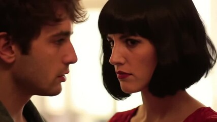 Man puckering for kiss, woman rejecting with a hand gesture