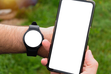 Smartphone and smart watch screen mockup for advertising, outdoors scene, marketing and creative...