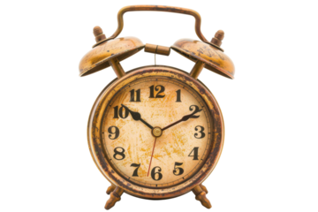 Vintage alarm clock with a weathered design showing time just before noon in a simple studio setting