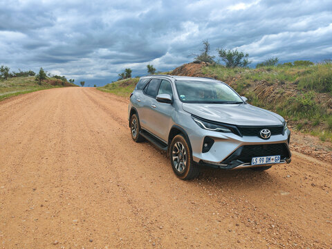 Off-road driving a rental car on a gravel road, a 4x4 track in a sandy desert landscape in Namibia. Toyota Fortuner SUV 4x4 off-road vehicle.
March 8, 2025.  Kalahari, Namibia Africa.