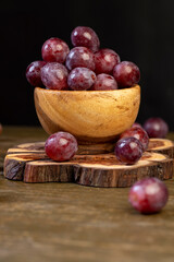 pink ripe grapes after washing the berries, clean wet grapes safe for eating close up