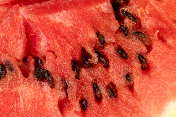 watermelon pulp with black seeds, sweet ripe watermelon cut into halves