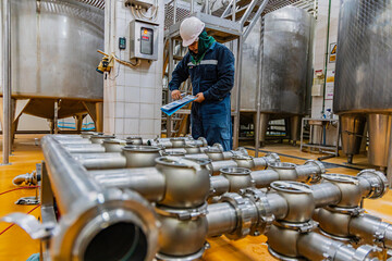 Male work inspection process stainless steel pipe stainless with pressure meter in equipment tank...