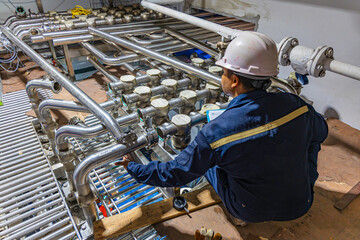 Male work inspection process stainless steel pipe stainless with pressure meter in equipment tank...