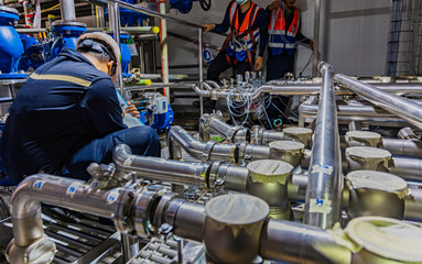 Male work inspection process stainless steel pipe stainless with pressure meter in equipment tank...