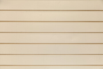 Beige panels background. Pastel plastic exterior wall design.
