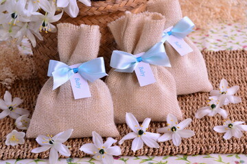 Baby shower baptism favors scented sachet gift bag white jute blue ribbon bow wicker flowers...