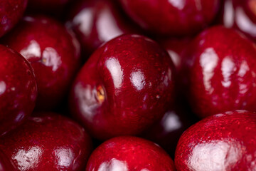 ripe red cherry berries , red cherry fruits on the kitchen table closeup