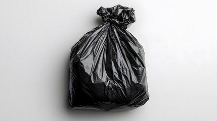 Tied Black Trash Bag with White Background.
