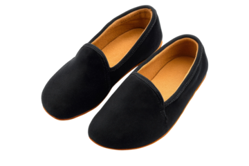 Elegant black fabric slippers with a soft tan inner sole detailed stitching and a sleek design against a on transparent background