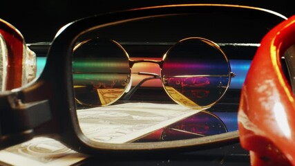 Trendy optic eyeglasses frames on a black background, close up sale concept. Optic shop promotion banner, poster. Eyewear fashion