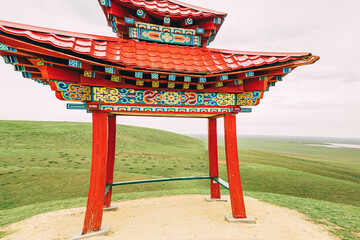 The gazebo in Elista, decorated with intricate patterns and surrounded by lush greenery, serves as...