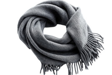 Luxurious gray wool scarf elegantly draped soft texture detailed fringe isolated on black on transparent background