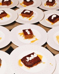 Chocolate cake squares with cream and caramel.