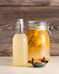 Tepache, fermented mexican pineapple drink, in a glass jar, selective focus