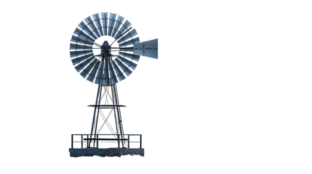 Metal windmill in rural landscape, vintage farm equipment countryside scene