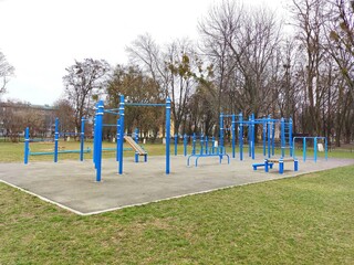 Fototapeta premium School sports ground. Empty sports ground for outdoor training. Horizontal bars