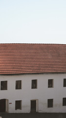 Obraz premium Tile roof details of an ancient castle with medieval stone architecture