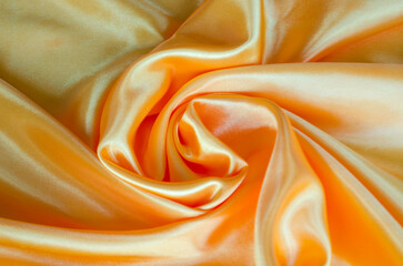 Golden yellow silk with silky sheen suitable for design and wallpaper background