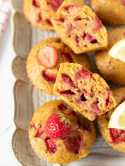 Homemade strawberry lemon muffins on rustic plate. Top view.