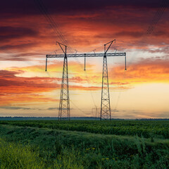 Scenic evening landscape of the Ukrainian steppe with a high-voltage Transmission tower