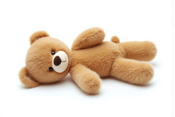 brown teddy bear laying down on a white background