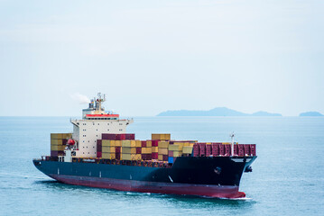 Cargo container ship sailing near Singapore. She is starting voyage on her international trade...