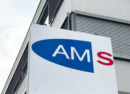 Ams logo on modern office building exterior with contemporary architecture