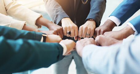 Hands, fist bump and group of business people in circle for cooperation, trust or synergy for goal....