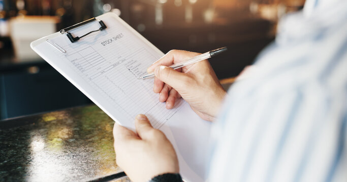 Person, hands and writing with inventory at cafe for stock sheet, checklist or catering service. Closeup, small business owner or manager with inspection or notes for order or products at coffee shop