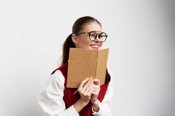 smiling girl with notebook, casual style, white background, joyful expression, creative concept, education, happiness, young woman, holding a pen, engaging with ideas, cheerful demeanor, stylish glas