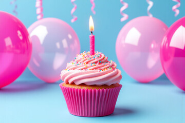 cupcake with a lit candle on top of it