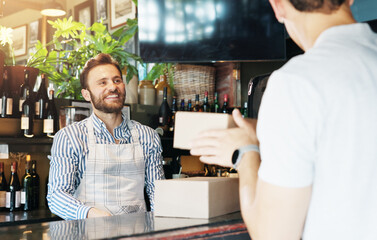 Man, waiter and package for customer with smile for catering service, food and sale at diner. Person, barista and happy with boxes, order collection and meal with small business owner at restaurant