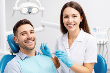 Obraz premium A dentist and a patient smiling in a dental clinic during a check-up.