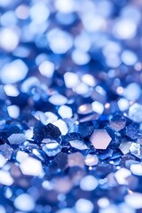 Close-up of shimmering blue glitter,  faceted and reflecting light