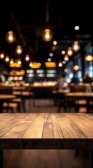 Empty wooden table in a dimly lit restaurant with blurred background of people dining