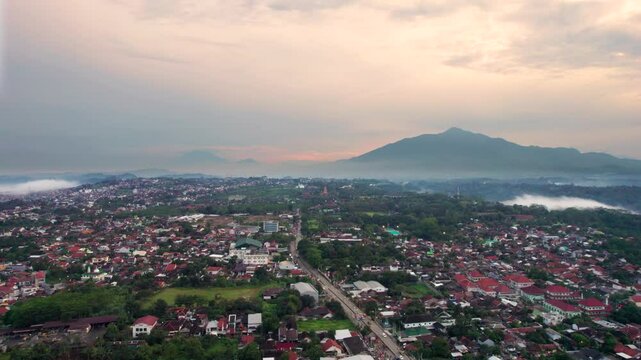 Aerial view semarang city with beautiful mount ungaran background. Drone view banyumanik regency in the afternoon after rain.