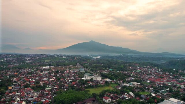 Aerial view semarang city with beautiful mount ungaran background. Drone view banyumanik regency in the afternoon after rain.