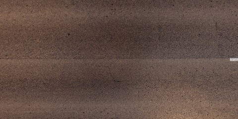 view from above on texture of asphalt road surface with cracks