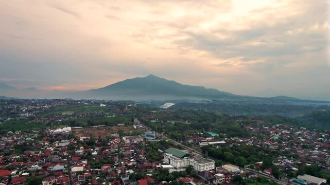 Aerial view semarang city with beautiful mount ungaran background. Drone view banyumanik regency in the afternoon after rain.