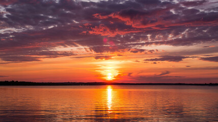 Fototapeta premium as the sunset casts vibrant colors.