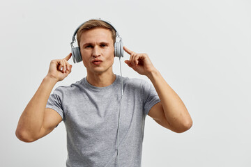 young caucasian man working with headphones listen music enjoy digital nomad lifestyle casual wear...