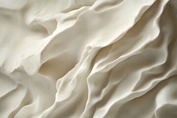 Obraz premium Close-up view of sculpted abstract shapes in pale cream.