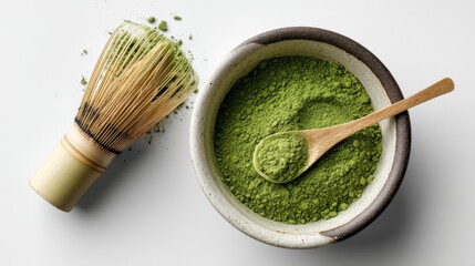 Green Matcha Powder in Bowl with Bamboo Whisk on White Background for Culinary Uses